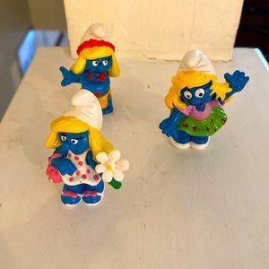 Three, classic Smurfette figurines